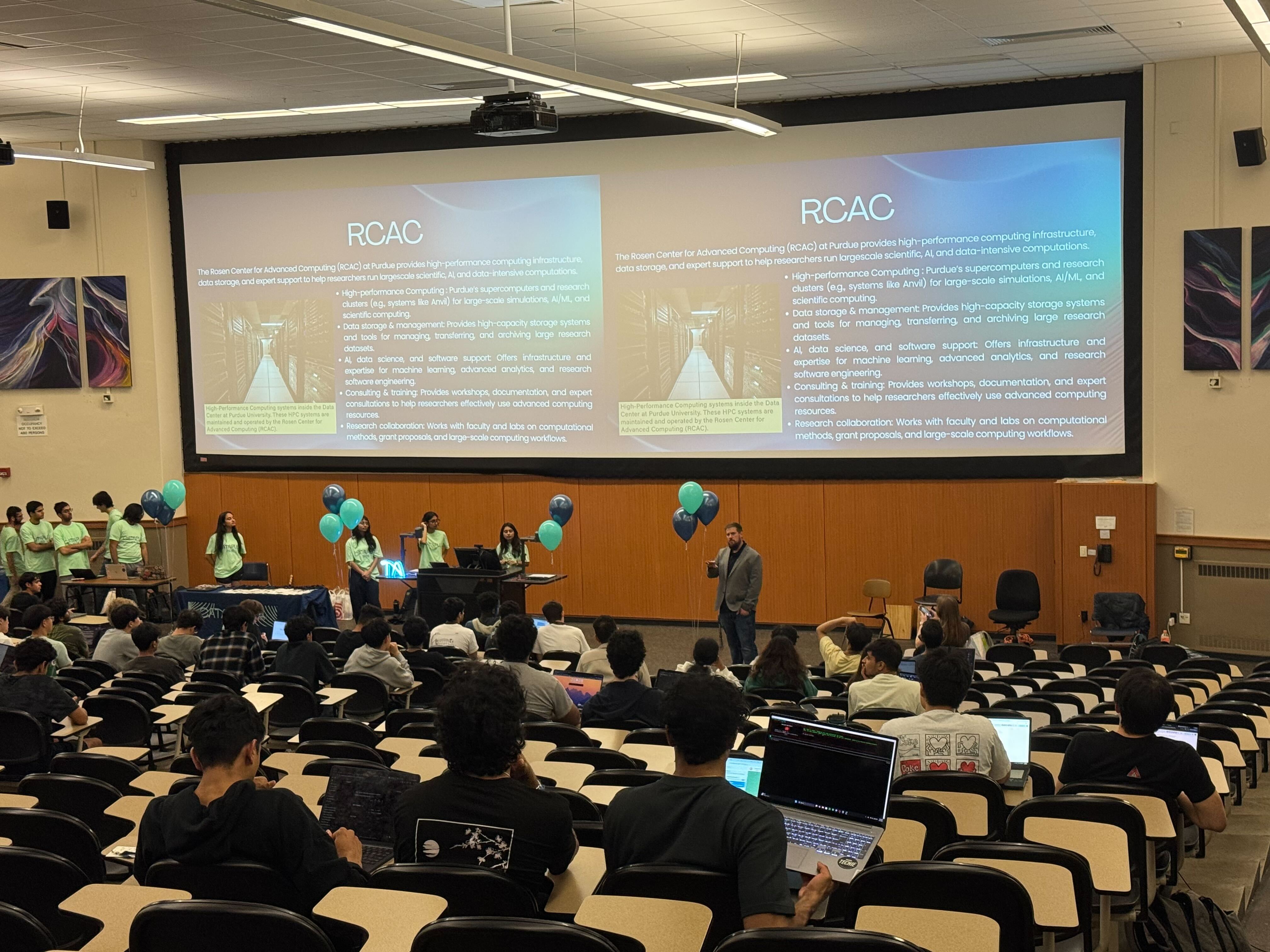 RCAC staff presenting to room full of people at Catapult 2026 hackathon