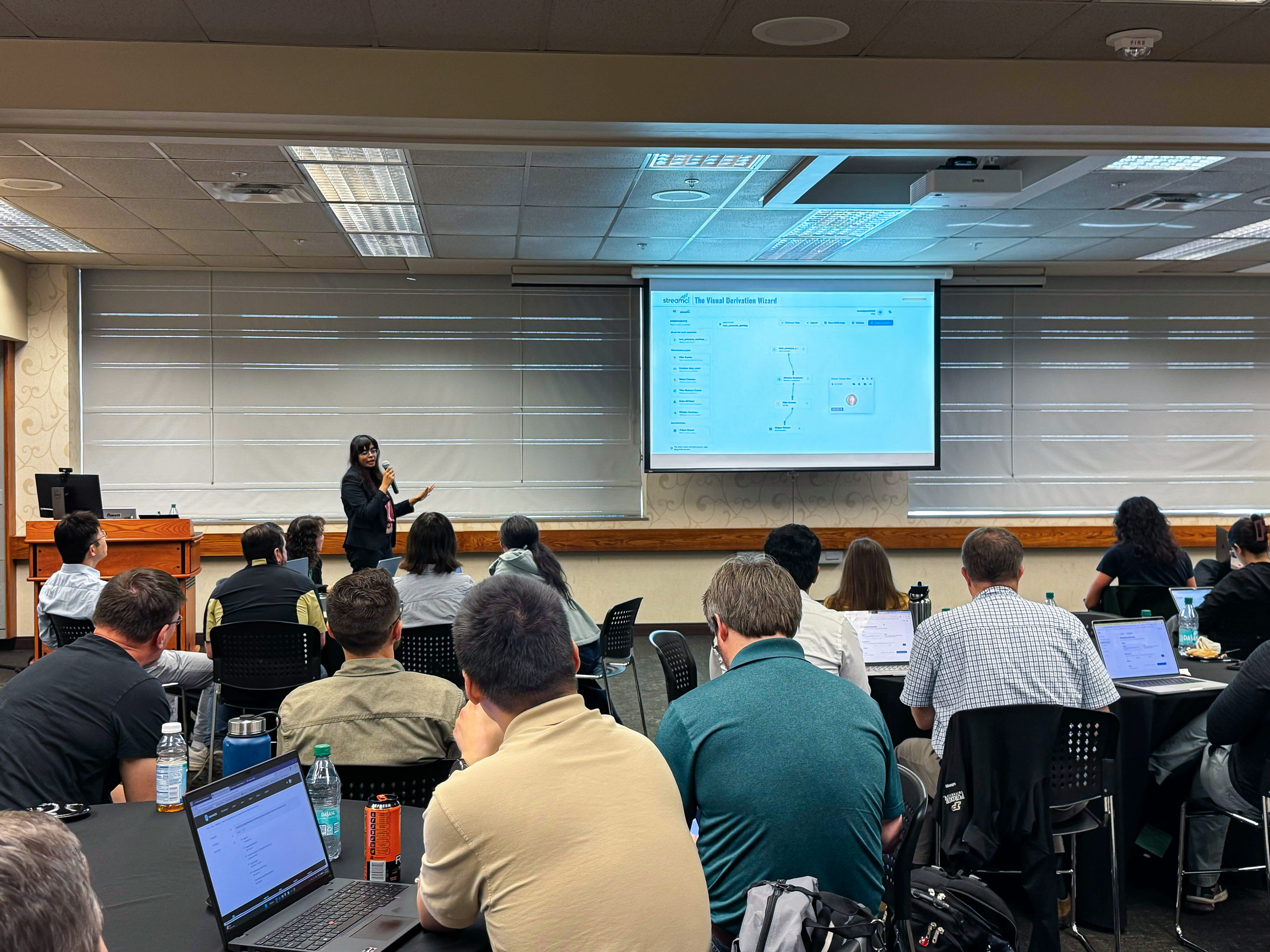 Faculty member showcasing StreamCI use case to room full of attendees