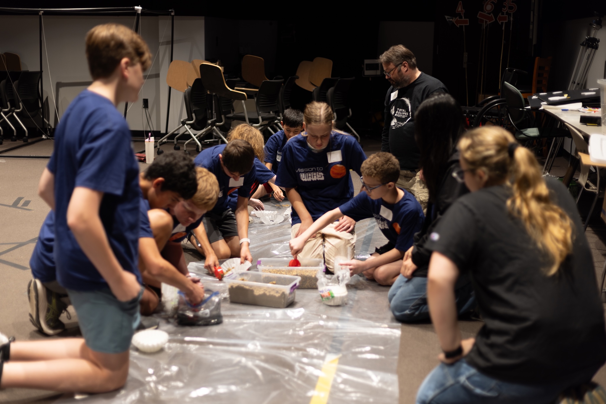 Mission to Mars Summer Campers testing their DIY water filtrations systems