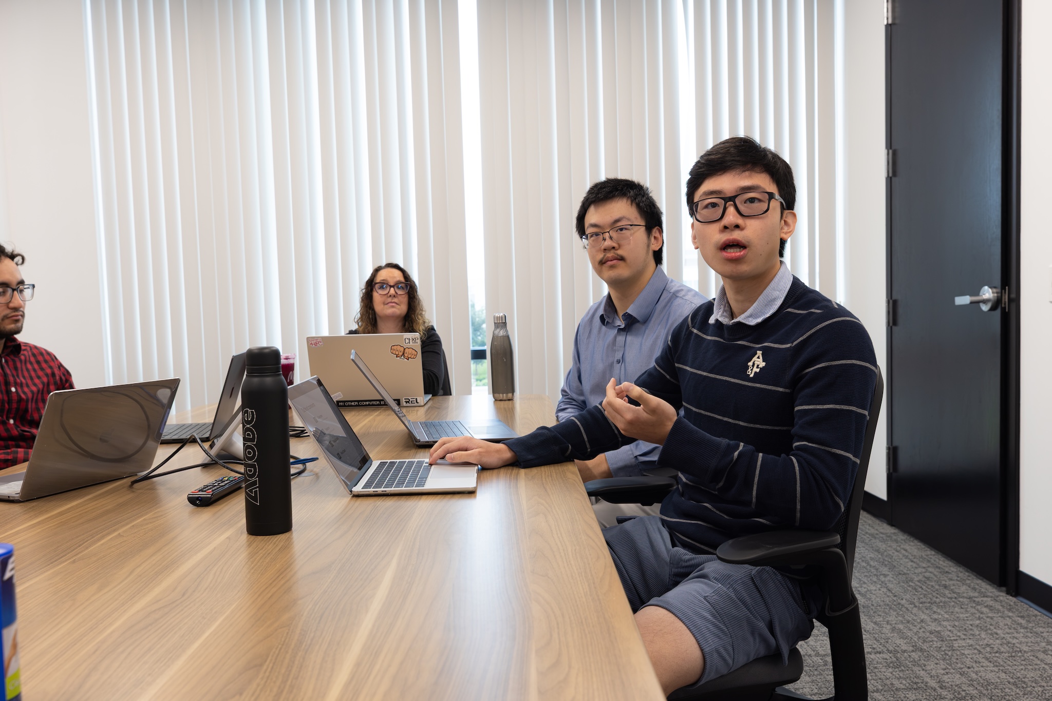 Howie Lin and Eric Jin giving a presentation during the halfway point meeting