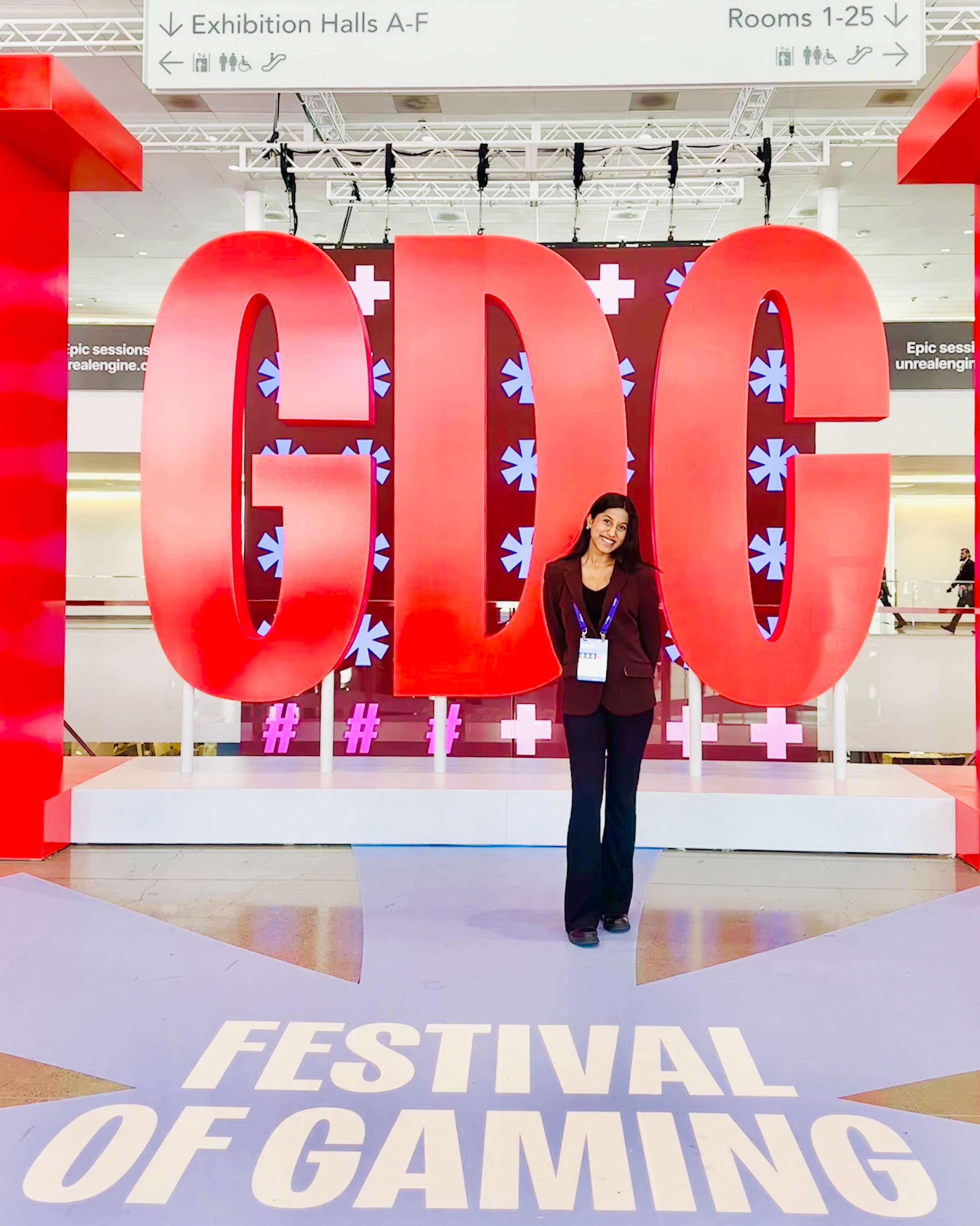 Aishwarya Bhosale standing in front of GDC conference sign
